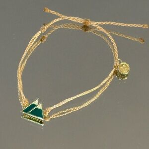 Pura Vida. Beige Braided Bracelet with Green Enamel Triangle/Mountain Charm
